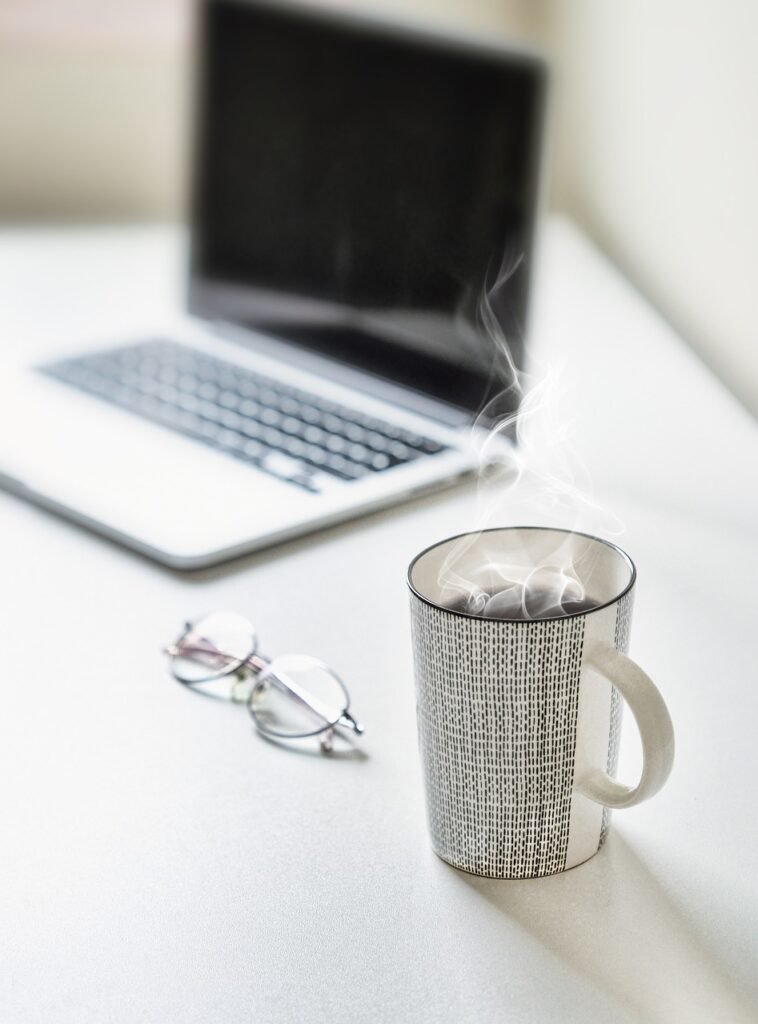 desk, tea cup, tea, coffee, coffee cup, table, laptop, cup, mug, workplace